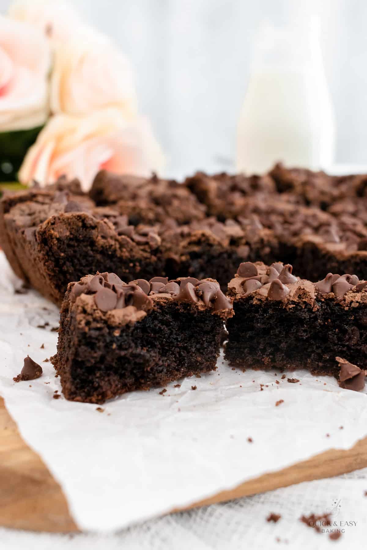 Close up view of brownies on a wooden board.