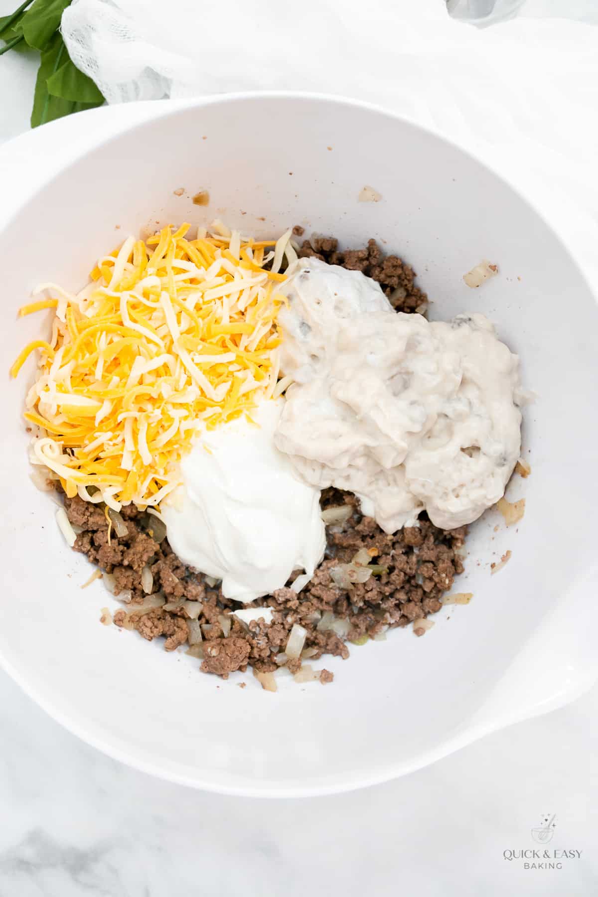 Ingredients for tater tot casserole in a bowl.