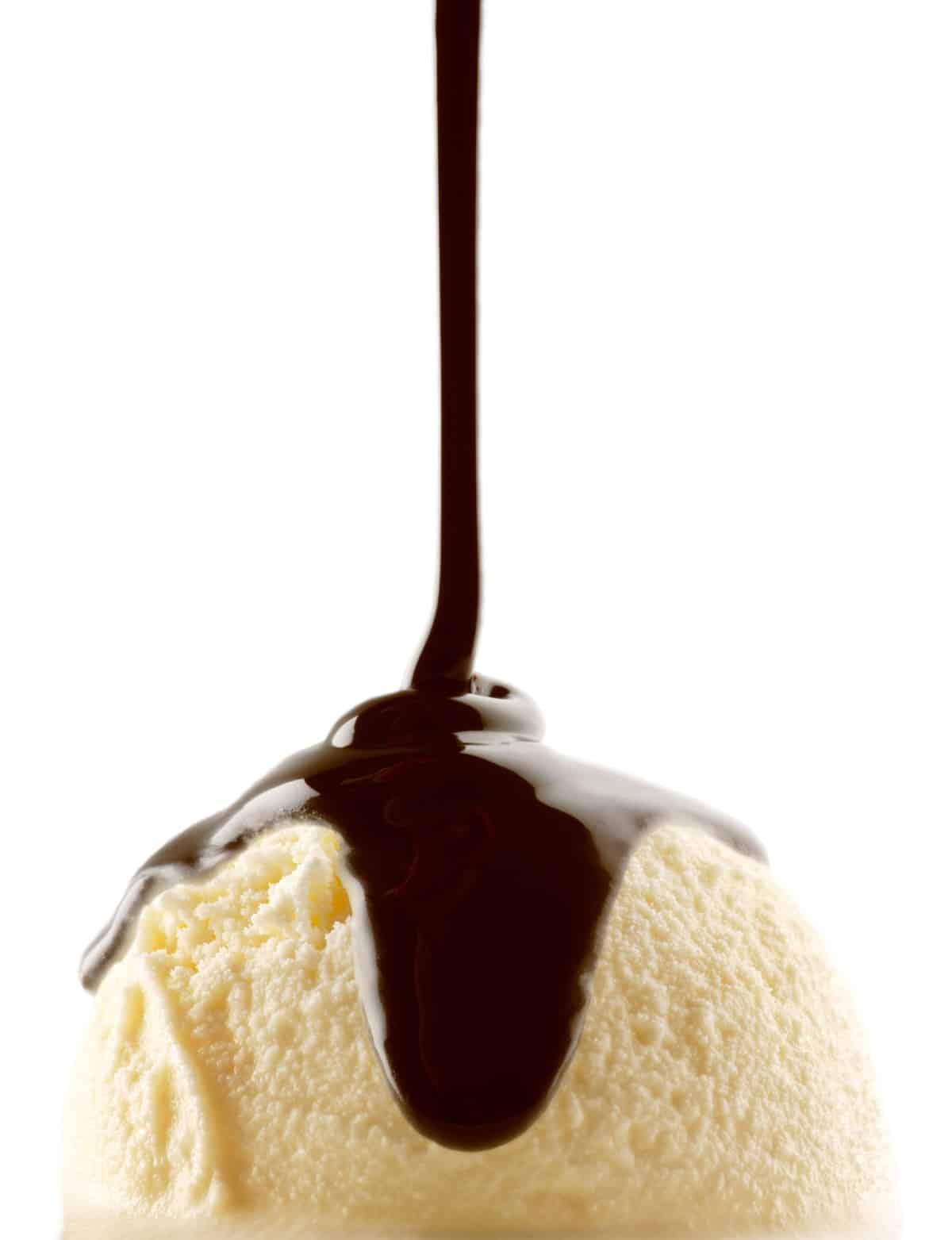 Chocolate syrup on ice cream.