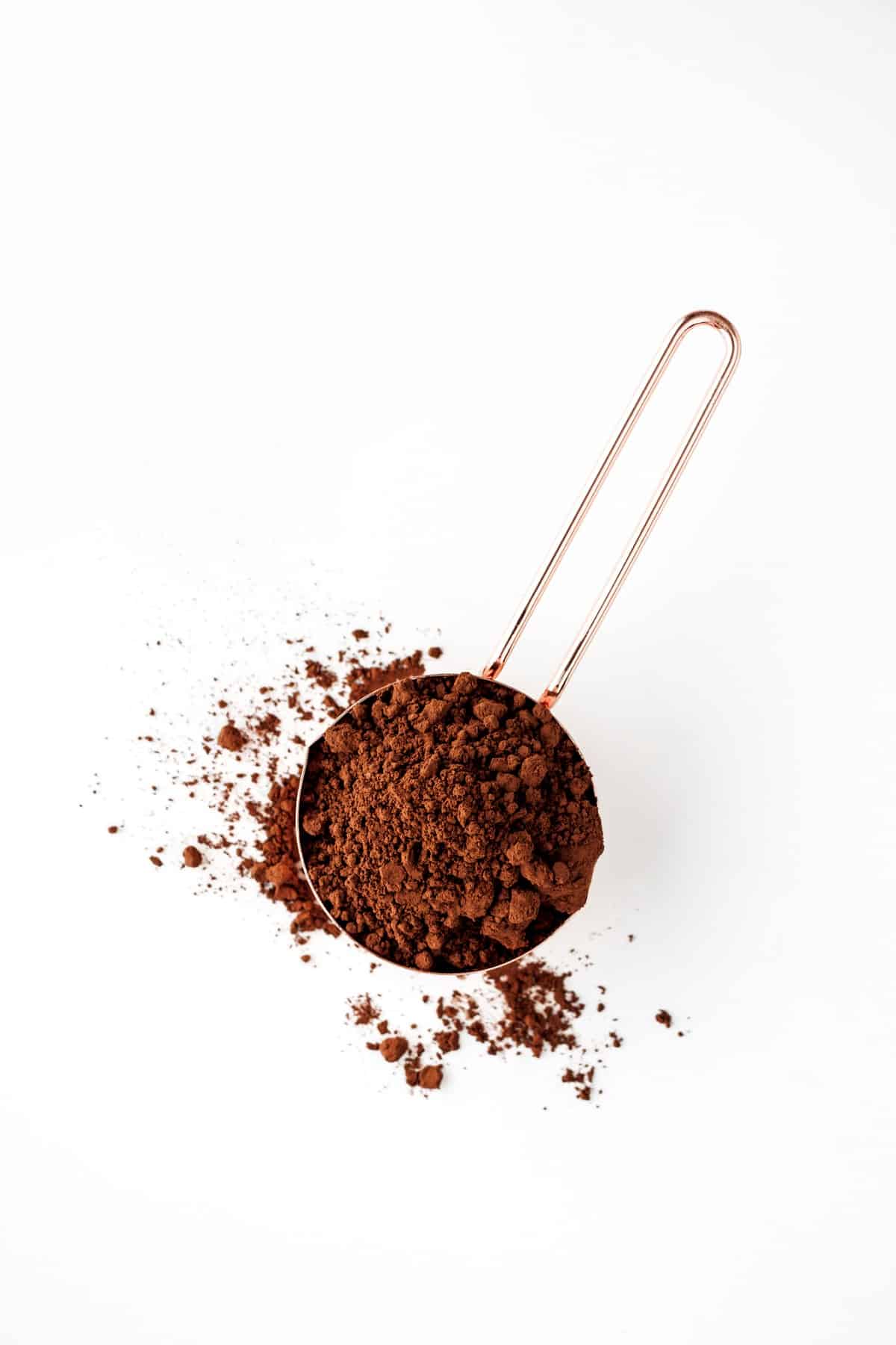 Cocoa powder in measuring cup.