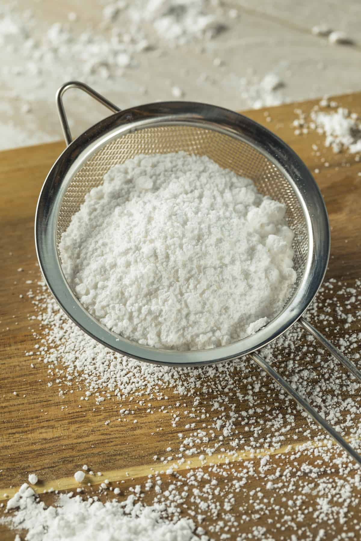 Confectioners sugar in a sifter.