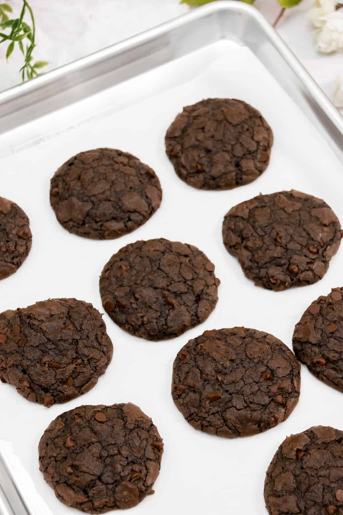 Brownie cookies cooling on a pan.