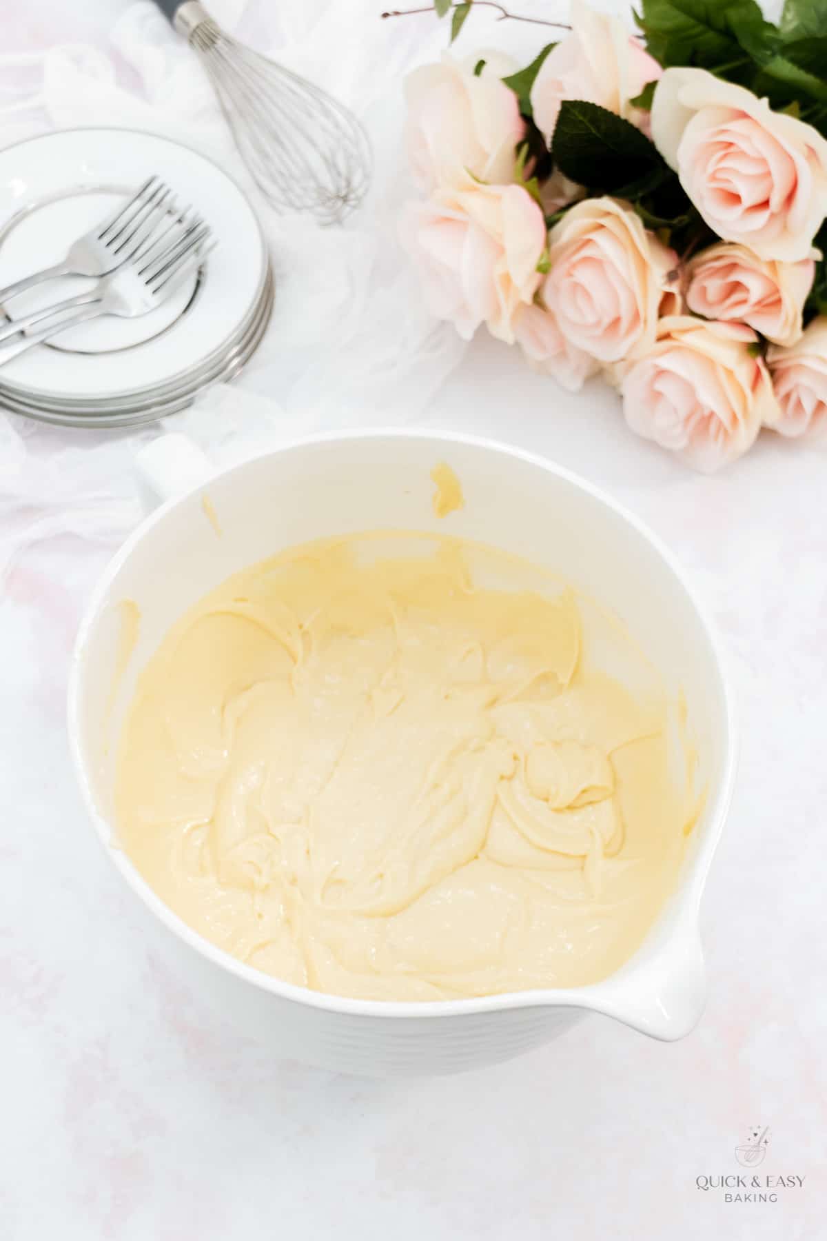 Cake batter mixed in a large white bowl.