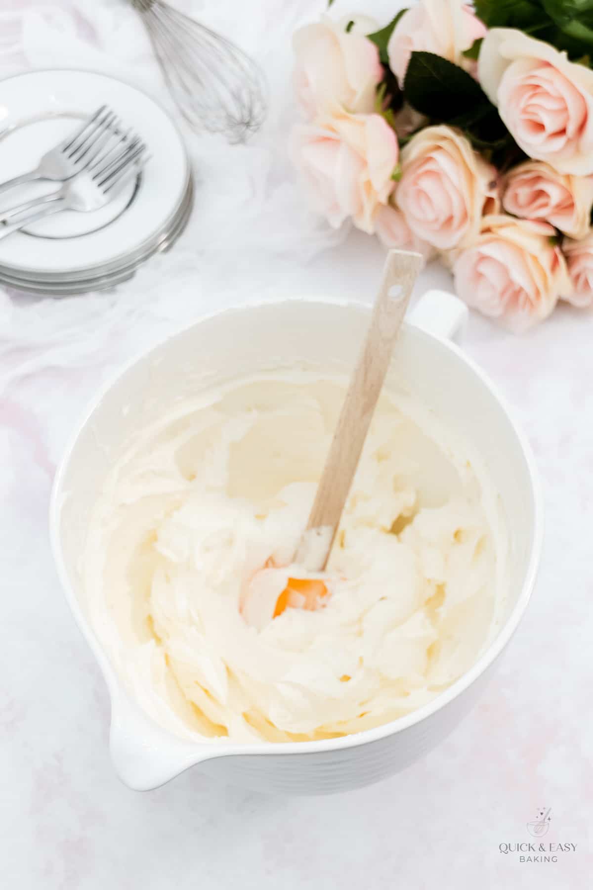 Vanilla buttercream mixed in a bowl.