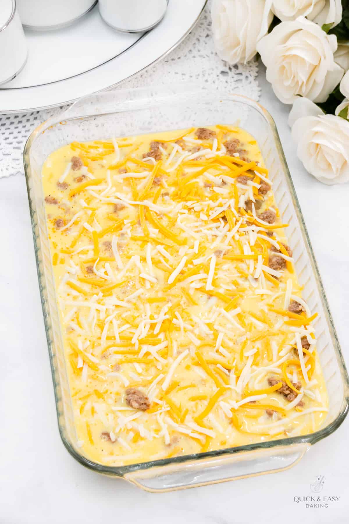 Egg casserole with sausage mixture in a casserole dish.