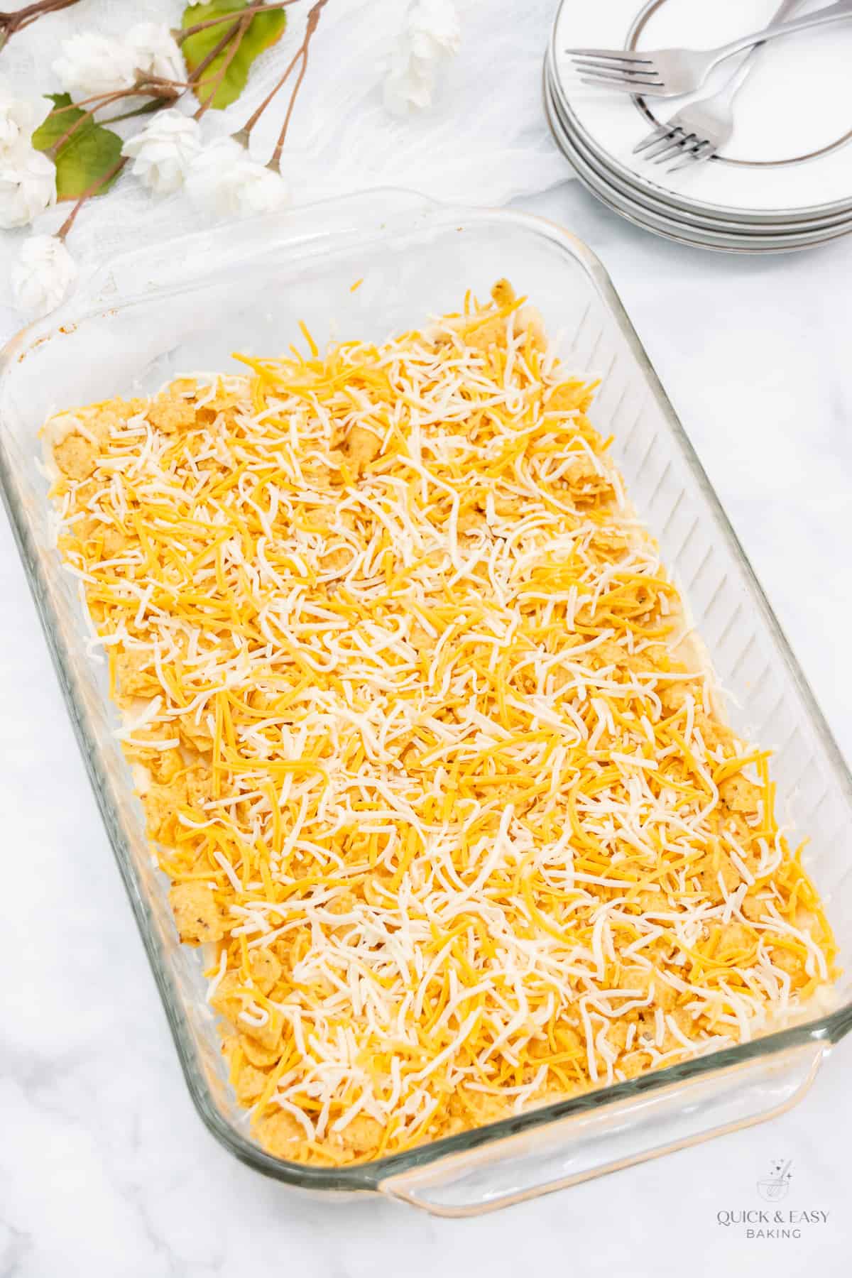Cheese sprinkled onto a taco casserole.