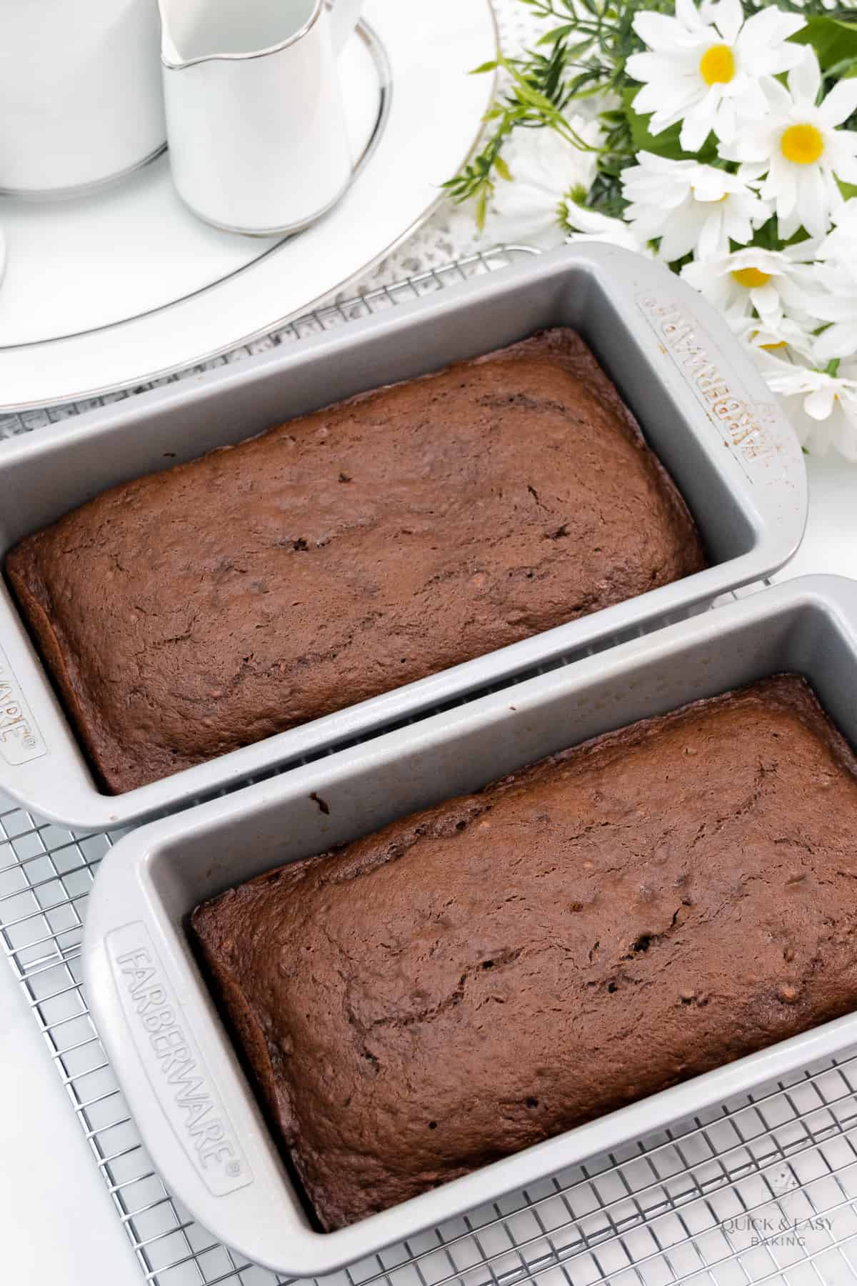 Baked chocolate banana bread in two loaf pans.