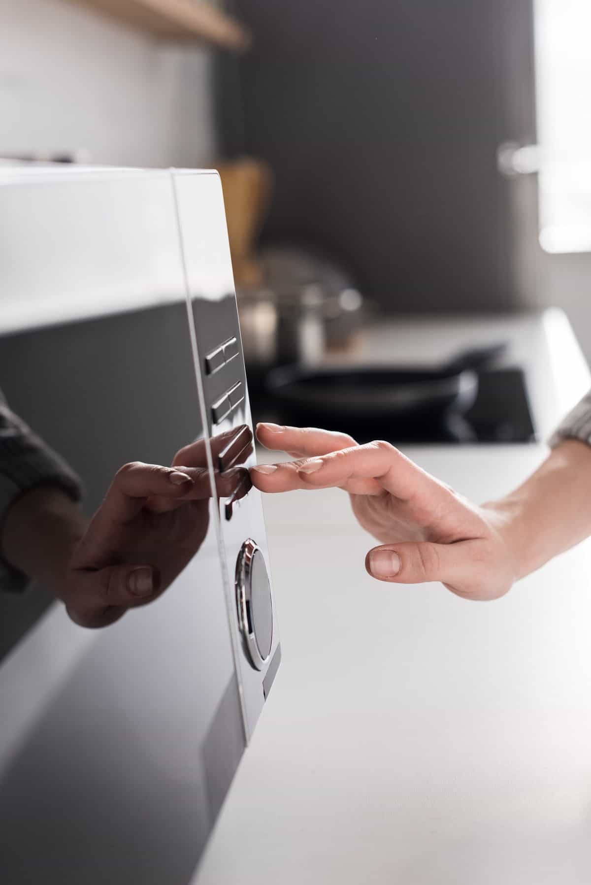 Microwave with hand.