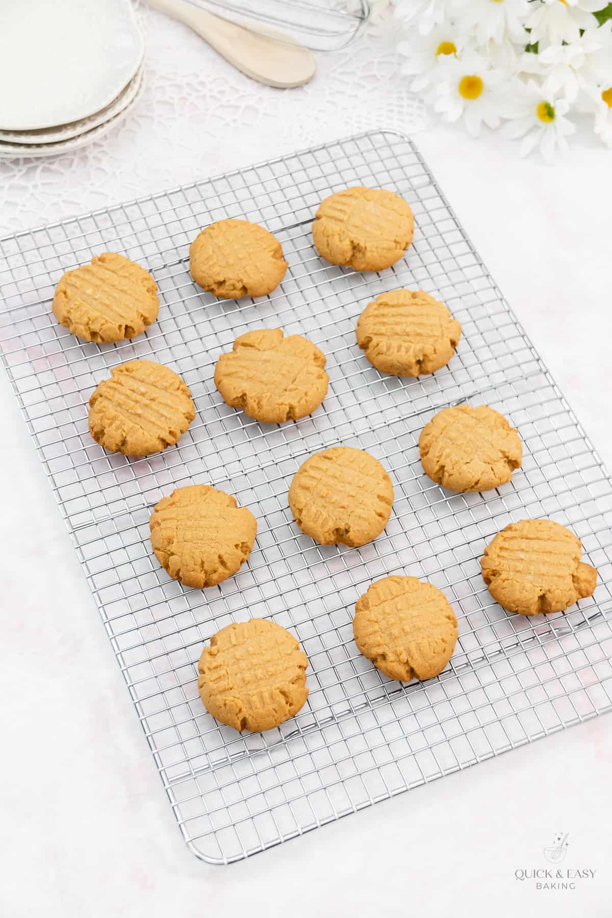 Baked soft peanut butter cookies on a cooling rack.