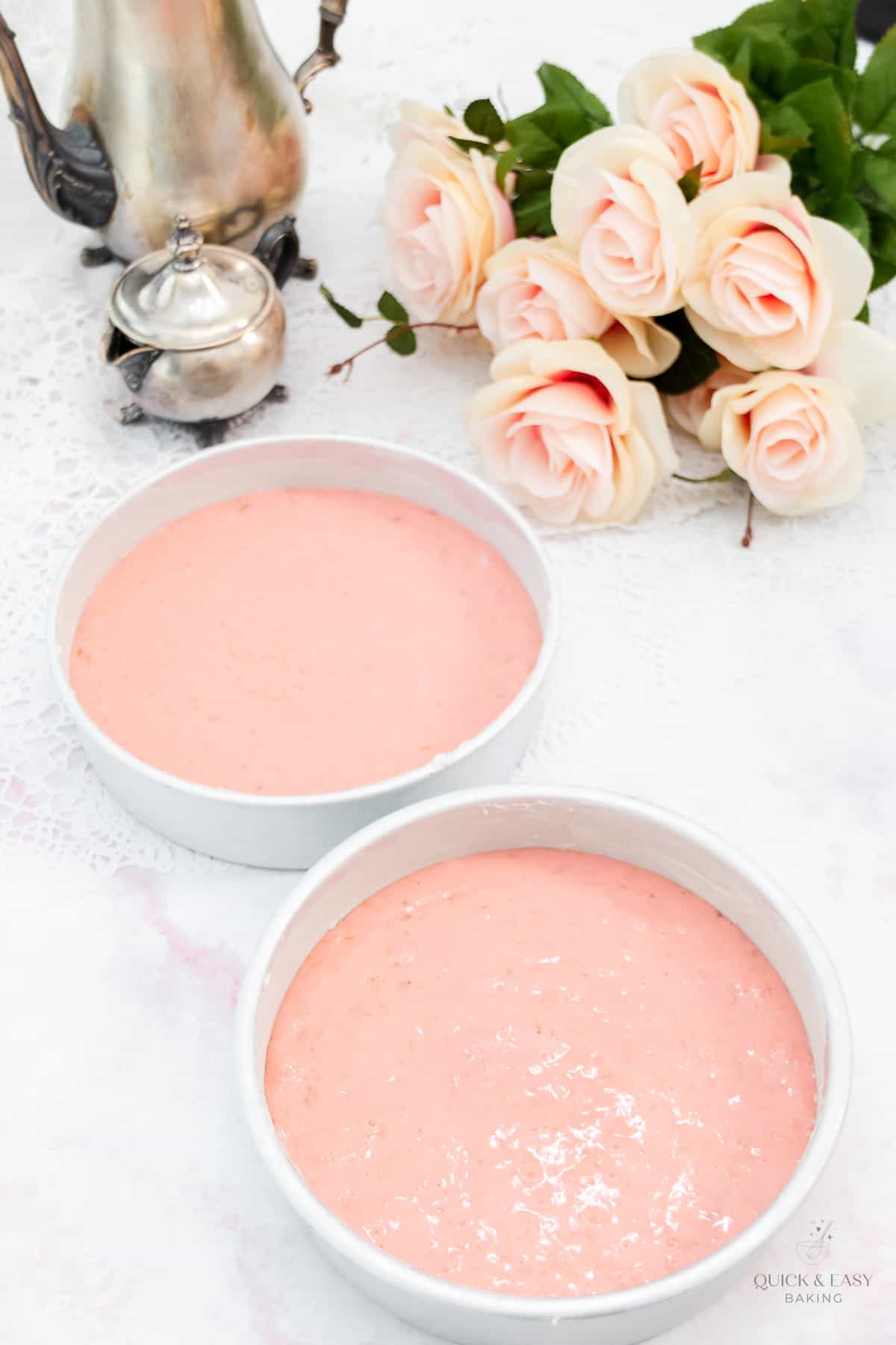 Strawberry banana cake batter in two pans.