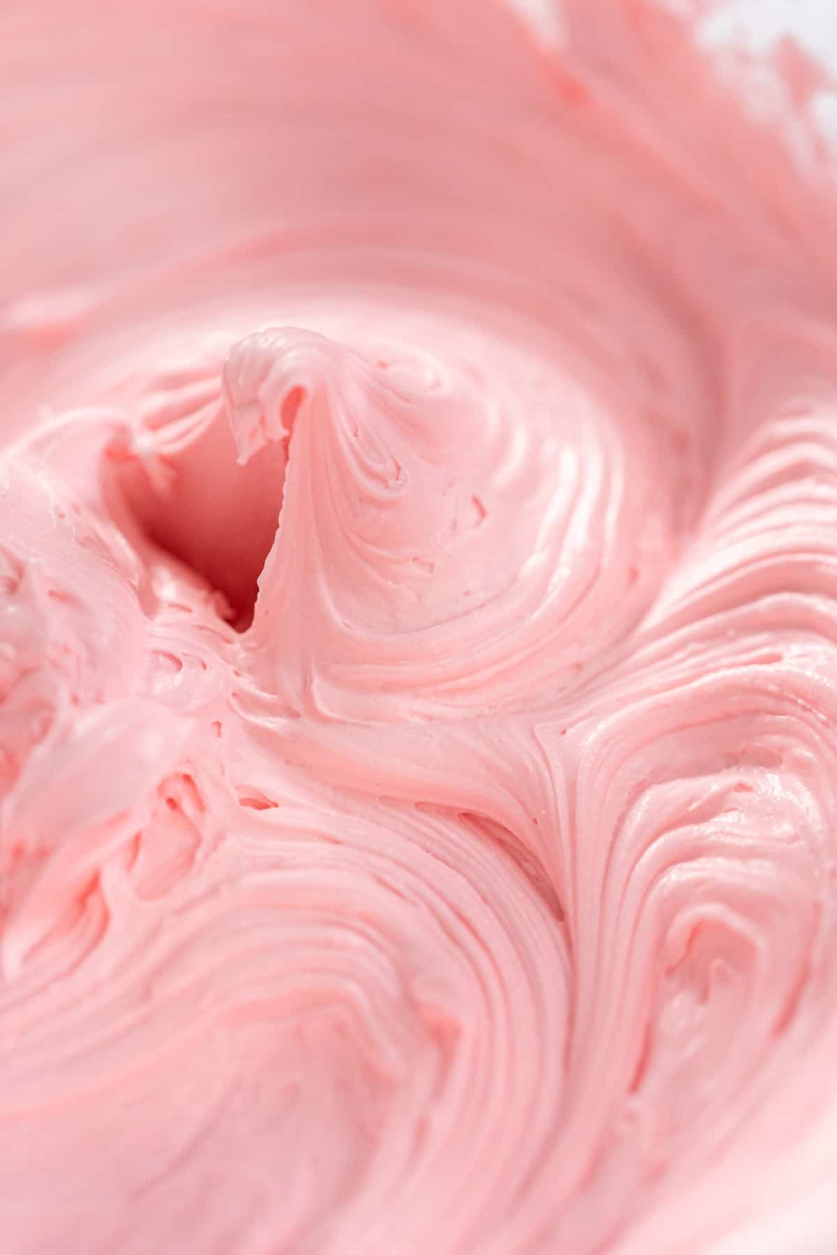 Pink frosting whipped.