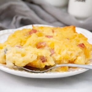 Hashbrown breakfast casserole with a fork on a plate featured image.