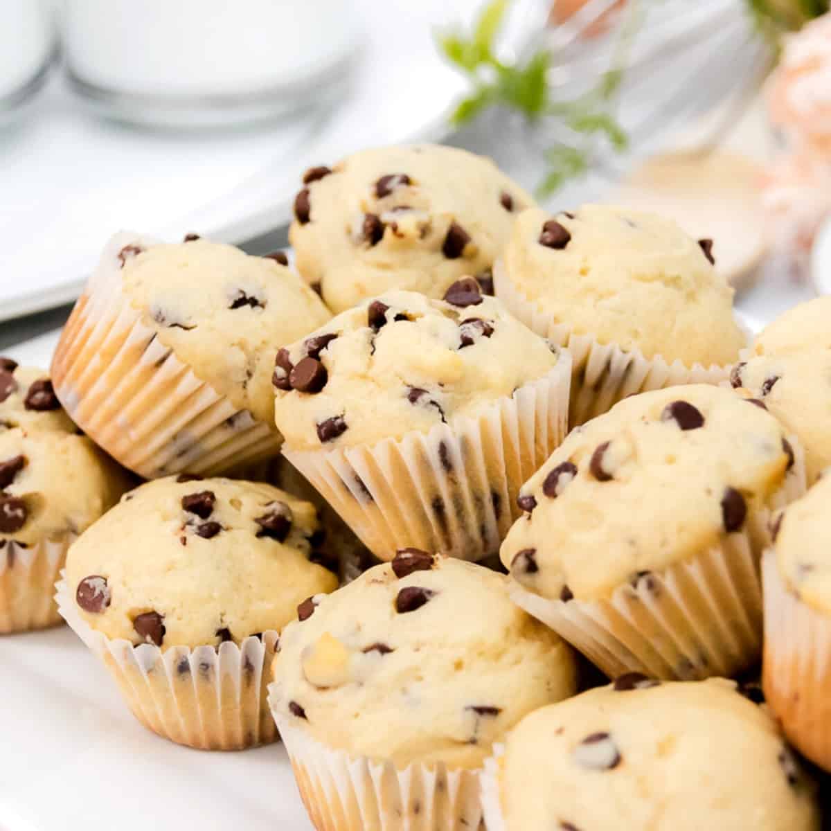 Featured image of mini muffins close up on a white platter.