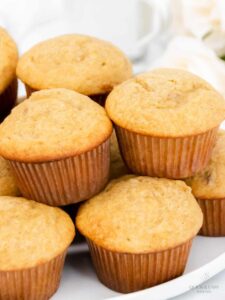 Close up side view of stacked banana muffins.