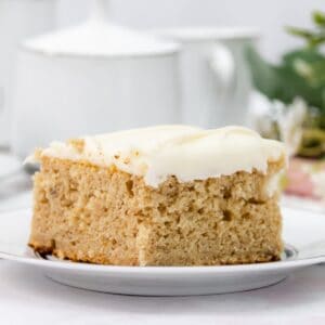 Featured image of banana cake bars with cream cheese icing.