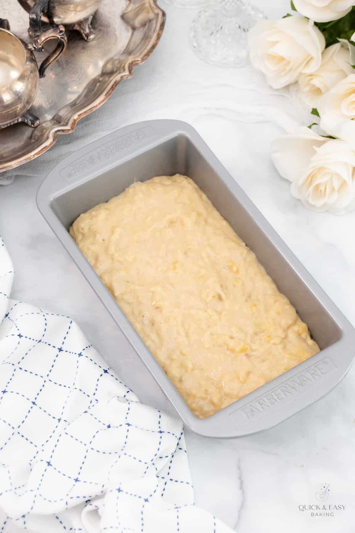 Banana bread batter in a loaf pan.