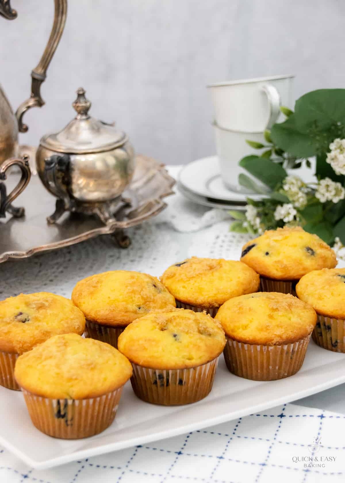 Top view of baked breakfast muffins on a white platter.