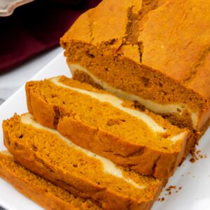 Featured image of pumpkin bread with cake mix and cream cheese.
