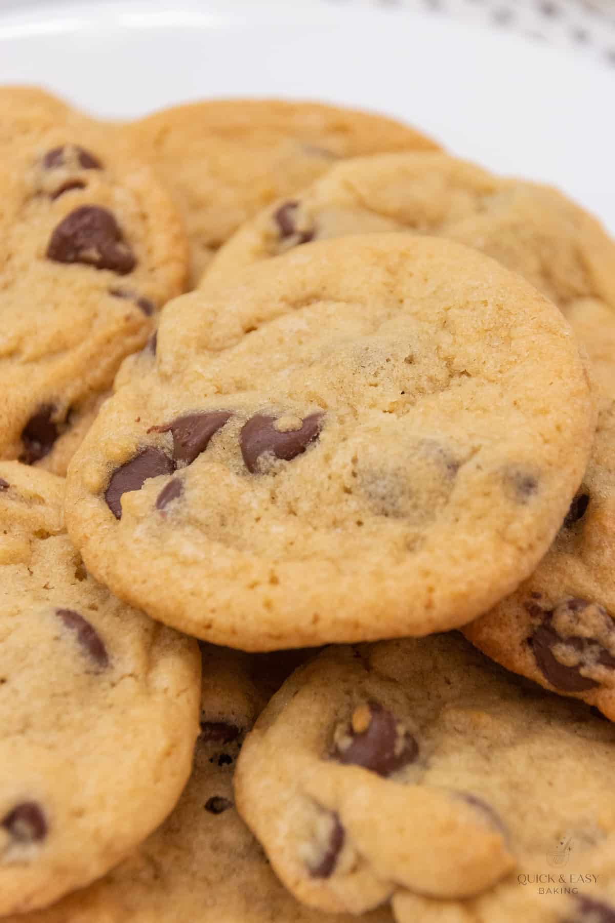 Close up view of baked cookies on a white platter.